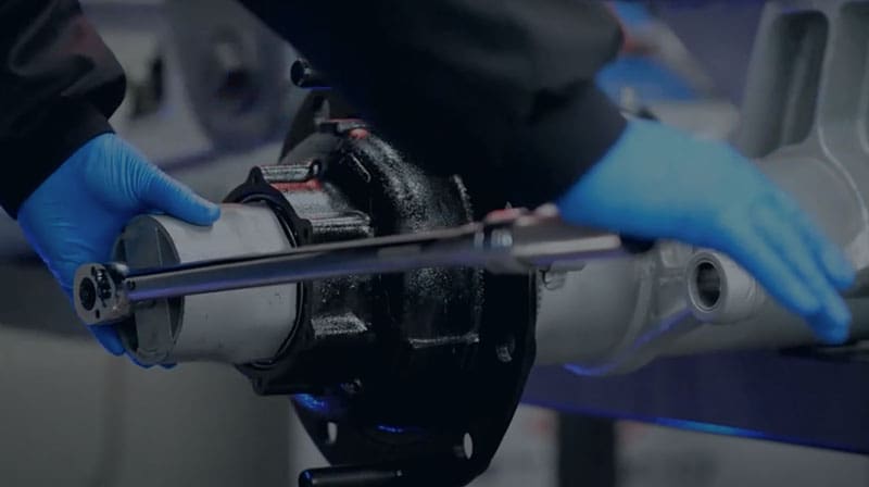 Someone putting together a pre-adjusted hub assembly